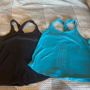 Under Armour tank tops.,